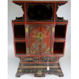 JAPANESE LACQUERED TABLE TOP CABINET having blind panelled central cupboard flanked by open