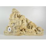 CARVED ORIENTAL SOAPSTONE LANDSCAPE depicting pagodas, pine trees & figures, unmarked, 20cms high