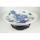 CHINESE PORCELAIN BLUE & WHITE PEDESTAL BOWL depicting four claw dragon chasing flaming pearl within