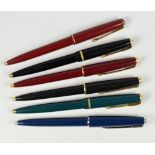 THREE PARKER 17 BALLPOINT PENS one black, one green, one red - all with gold plated trim together
