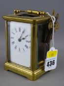 A brass cased carriage clock with two keys