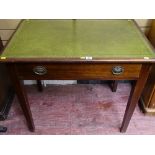 A single-drawer mahogany writing desk with cream gilt tooled leather top & tapering square supports