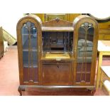 A double dome top vintage walnut side-by-side bureau