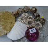 Cowrie shell napkin rings, glass paperweight and similar items