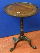 A tray top occasional table on a carved tripod base