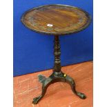 A tray top occasional table on a carved tripod base