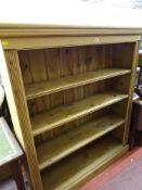 A good quality antique-style pine open bookcase
