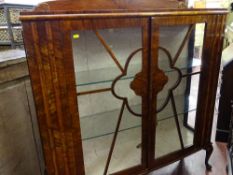A vintage two-door china display cabinet