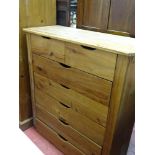 A modern pine chest of two short over five long drawers