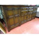 A Priory oak style long sideboard