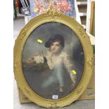 Gilt oval framed print AFTER THE ORIGINAL young boy with rabbit