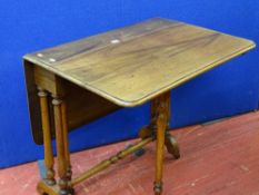 A Victorian mahogany Sutherland table on turned supports & stretcher with brown pot castors