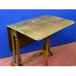 A Victorian mahogany Sutherland table on turned supports & stretcher with brown pot castors