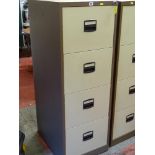 A modern four-drawer metal file cabinet with key