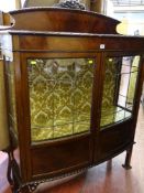 An excellent circa 1900 mahogany china display cabinet, the leaded glass doors with blown top
