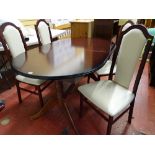 A mahogany extending dining table & four upholstered high back dining chairs