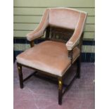 Pink upholstered armchair on tapered supports
