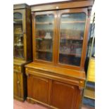 Antique bookcase cupboard with twin glazed upper doors, central drawer and two base cupboards