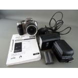 Canon EOS camera with Neewer attachable flash, charger and battery