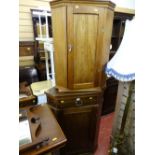 Polished wood corner hanging cupboard and another base corner unit with single drawer over a