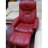 Red upholstered 'Stressless' chair and matching footstool