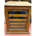 Small single glazed door collector's display chest with interior multi drawers