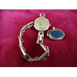 Lady's nine carat gold wristwatch and an agate fob