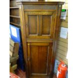 Two door floorstanding corner unit with carved and panel detail