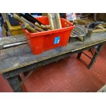 Old garage workshop bench with fitted vice and a red tub of hand tools, vintage blow lamp etc