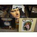 Box of vintage LP records, various artists including Phil Collins, The Platters, classical and