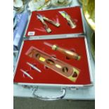 Presentation set of brass and wooden hand tools in a fitted silver coloured travel case
