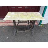 Vintage Singer treadle sewing machine base with marble top