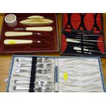 Two vintage cased part manicure sets and a boxed set of EP cake forks