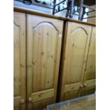 Pair of pine wardrobes and a multi drawer chest
