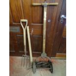 Vintage manual lawnmower 'Ransome's Ace Ballbearing', a small pick and a garden fork