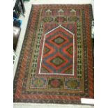 Old Baluchi prayer rug, multi-bordered deep colours with central red and blue ground panel, 148 x 88