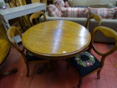 Circular mahogany pedestal dining table and four balloon back dining chairs with tapestry seats