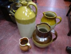 Three vintage stoneware jugs and a cider flagon