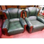 Two similar green faux leather and wood upholstered armchairs