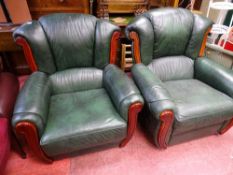 Two similar green faux leather and wood upholstered armchairs