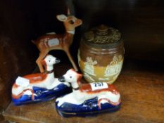 Pair of reproduction Staffs red and white dog penholders and a Doulton Lambeth lidded tobacco jar (