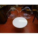 Pair of Eiffel style transparent chairs and a matching white topped occasional table