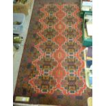Old Baluchi rug, bold red central pattern on a deep blue ground, 197 x 108 cms