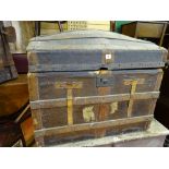 Wooden banded dome topped travel trunk