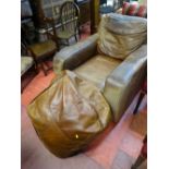 Vintage distressed leather armchair and pouffe