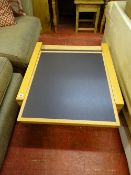 Ultra modern Italian designer light wood coffee table with four pull-out sections