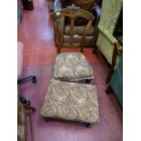 Oak carved back chair with floral upholstery and a matching footstool