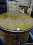 Oval mahogany coffee table on tripod scroll feet supports