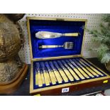 Excellent canteen of twelve bone handled fish knives and forks with matching pair of servers in silk