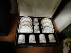 Boxed set of six delicate white china rose decorated cups and saucers